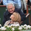 Dominique Strauss-Kahn et sa compagne Myriam L'Aouffir assistent à la victoire de Rafael Nadal lors des Internationaux de France à Roland-Garros le 9 juin 2013.