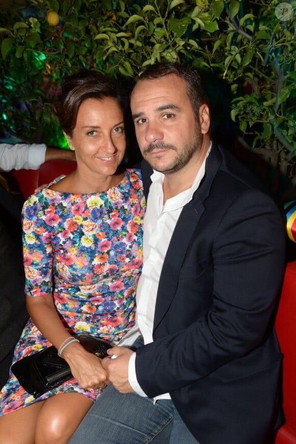 François-Xavier Demaison et sa femme Emmanuelle lors de la private party du Byblos de Saint-Tropez, le 18 juillet 2013.