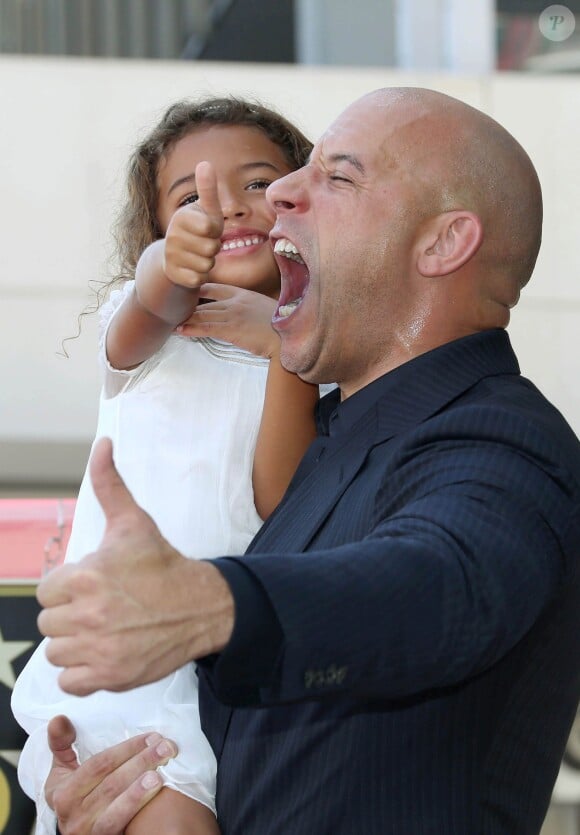 Vin Diesel radieux avec sa fille Hania sur le Walk of Fame, à Los Angeles, le 26 août 2013.