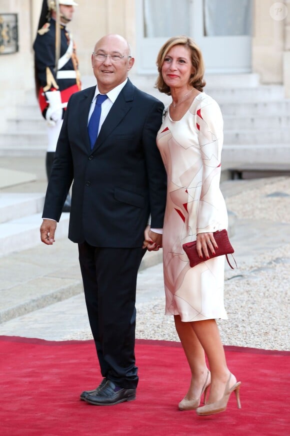 Michel Sapin et sa femme lors d'un dîner d'Etat à l'Elysée le 3 septembre 2013.