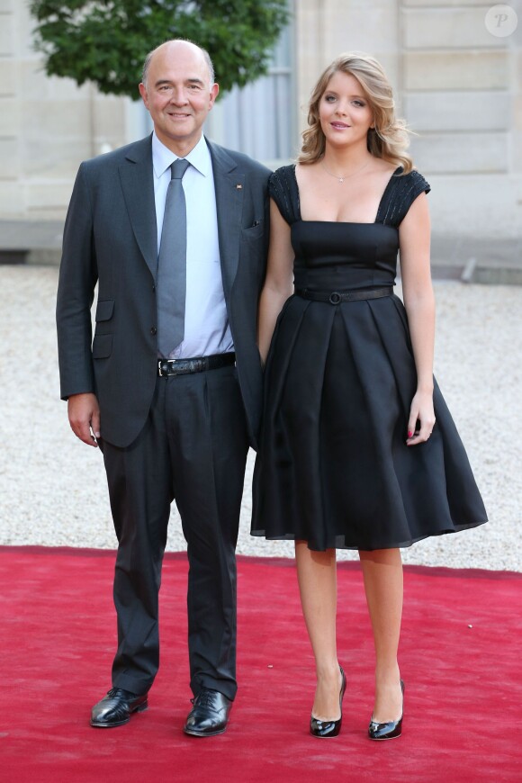 Pierre Moscovici et sa compagne Marie-Charline Pacquot lors d'un dîner d'Etat à l'Elysée le 3 septembre 2013.