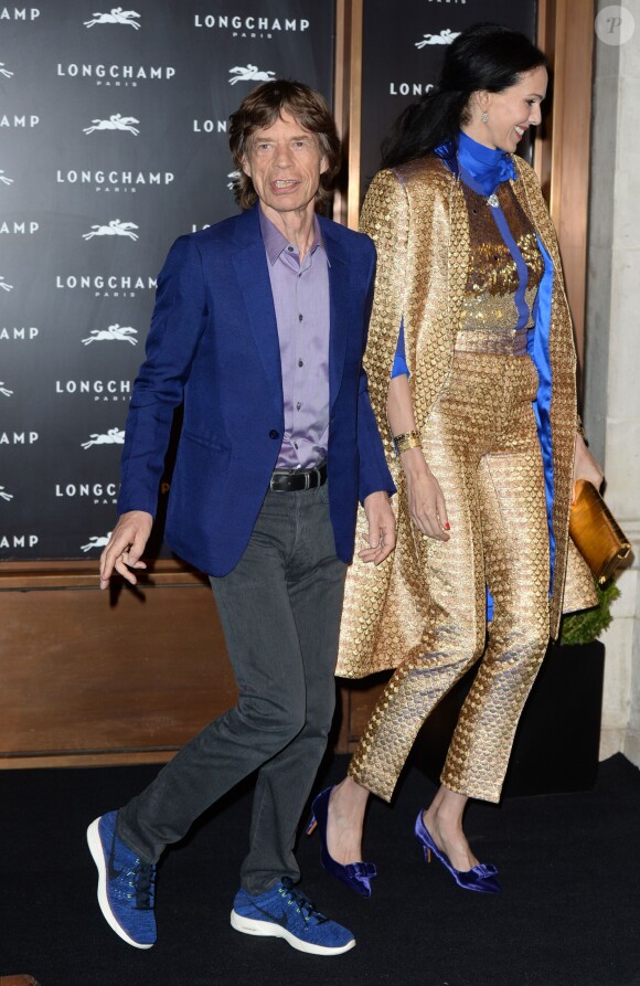 Mick Jagger et L'Wren Scott arrivent au 229 Regent Street pour l'inauguration de la nouvelle boutique Longchamp. Londres, le 14 septembre 2013.