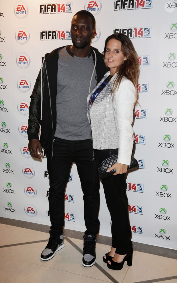 Omar Sy and et sa femme Helene à la soirée de lancement de FIFA 14, organisée à la Gaîté Lyrique, à Paris, le 23 septembre 2013. La simulation de foot d'EA Sports sort le 26 septembre.