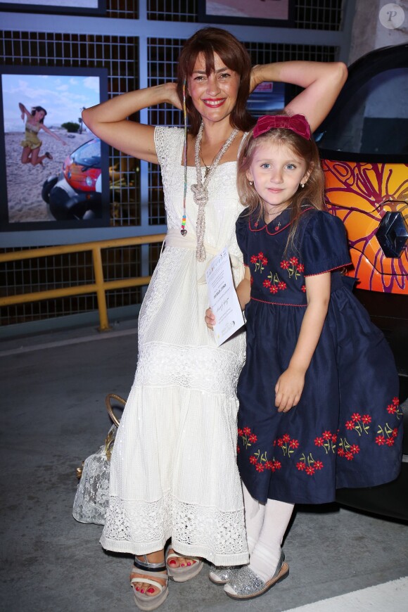 Rona Hartner et sa fille au Défilé Christophe Guillarmé collection printemps-été 2014 au Garage Renault République à Paris, le 25 septembre 2013.
