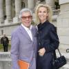 Jean Daniel Lorieux et sa femme Laura Restelli Brizard arrivent à la galerie sud est du Grand Palais pour assister au défilé Leonard printemps-été 2014. Paris, le 30 septembre 2013.