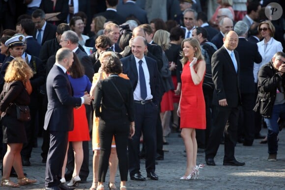 Pierre Moscovici et Marie-Charline Pacquot - Defile du 14 juillet 2013 a Paris. Traditional military parade as part of the Bastille Day celebrations in Paris, France, 14 July 2013.