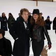 Francois Cluzet et sa femme Narjiss lors du défilé de mode Dior Homme prêt-à-porter automne-hiver 2013-2014 à Paris le 19 janvier 2013