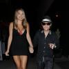 Corey Feldman et une charmante créature nocturne lors de son arrivée chez Bootsy Bellows à Los Angeles, le 11 juin 2013
