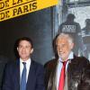 Manuel Valls (ministre de l'Intérieur) et Jean-Paul Belmondo lors de l'inauguration de l'exposition "100 ans de police judiciaire de Paris" au Champ de Mars à Paris le 8 novembre 2013. Cette exposition se tiendra du 9 novembre au 8 décembre 2013