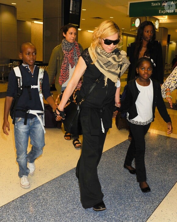 Madonna et ses enfants David, Mercy et Lourdes arrivent à New York en provenance de Londres, le 3 septembre 2013.