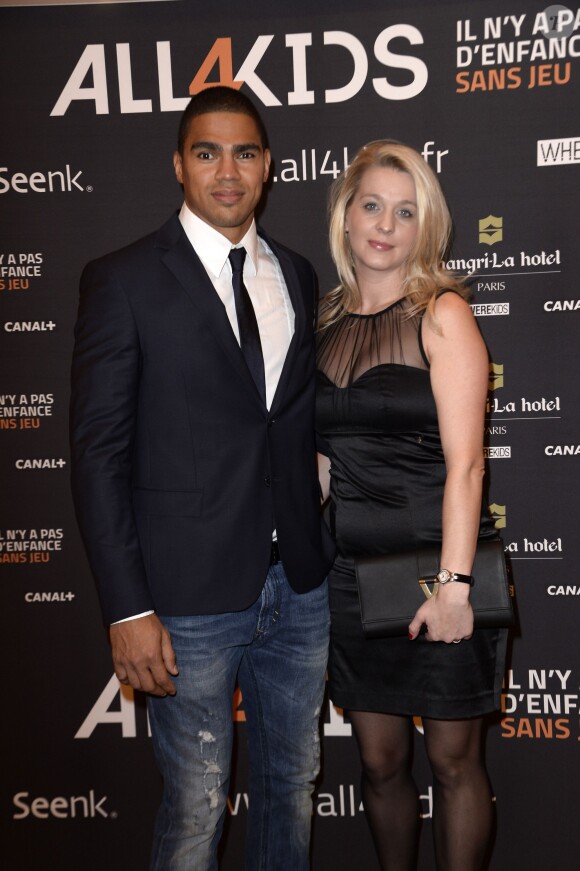 Daniel Narcisse et sa femme Emmanuelle le 20 novembre 2013 à Paris au dîner de gala en soutien à All4kids et Sports Sans Frontières au Shangri-La Hotel.