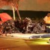 Les autorités intervenant et examinant la scène de l'accident fatal à l'acteur Paul Walker, star de Fast and Furious, tué à 40 ans dans le crash d'une Porsche GT dont il était le passager, le 30 novembre 2013 à Santa Clarita (nord de Los Angeles).