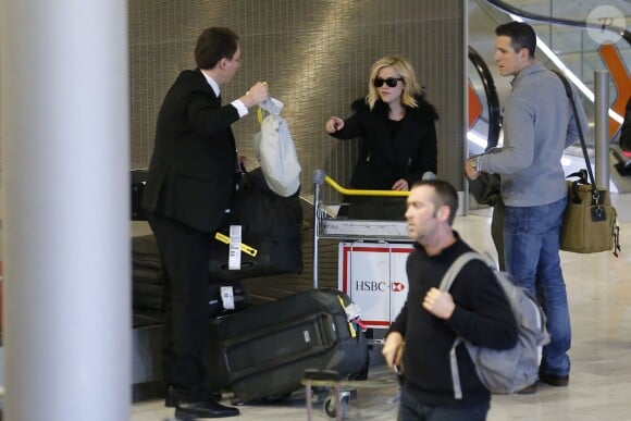 Reese Witherspoon et son mari Tim Roth à l'aéroport Roissy Charles de Gaulle. Roissy, le 7 décembre 2013.