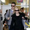 Deux stars en week-end à Paris : Reese Witherspoon et son mari Tim Roth arrivent à l'aéroport Roissy Charles de Gaulle. Roissy, le 7 décembre 2013.