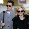 Reese Witherspoon et son mari Tim Roth à l'aéroport Roissy Charles de Gaulle. Roissy, le 7 décembre 2013.
