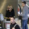 Reese Witherspoon et son mari Tim Roth à l'aéroport Roissy Charles de Gaulle. Roissy, le 7 décembre 2013.
