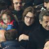 Nicolas Sarkozy, son fils Jean Sarkozy et son petit-fils Solal au Parc des Princes pour le match PSG/Nantes, le 19 janvier 2014.