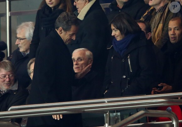 Nicolas Sarkozy et Anne Hidalgo lors du match entre le Paris SG et Nantes au Parc des Princes le 19 janvier 2014 à Paris