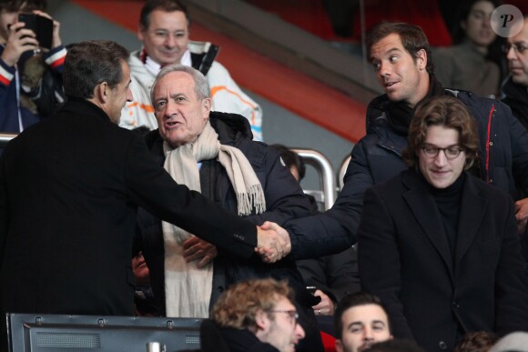 Nicolas Sarkozy, Jean Tiberi, Richard Gasquet et Jean Sarkozy lors du match entre le Paris SG et Nantes au Parc des Princes le 19 janvier 2014 à Paris