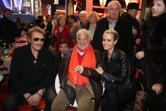 Jean-Paul Belmondo, Johnny Hallyday et sa femme Laeticia et Marcel Campion à la soirée d'inauguration de "Jours de Fetes" au Grand Palais à Paris, organisée par Marcel Campion, le 19 décembre 2013.