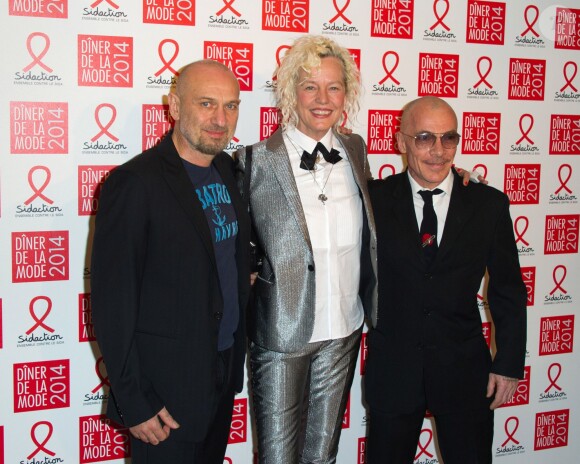 Les artistes Pierre et Gilles et la photographe Ellen Von Unwerth assistent au Dîner de la mode contre le sida, au pavillon d'Armenonville. Paris, le 23 janvier 2014.