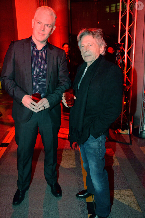 Exclusif - Roman Polanski et Wayne J. Burgess (designer Jaguar) lors de la soirée de lancement du coupé F Type R de Jaguar au 50 Avenue Montaigne à Paris, le 23 janvier 2014