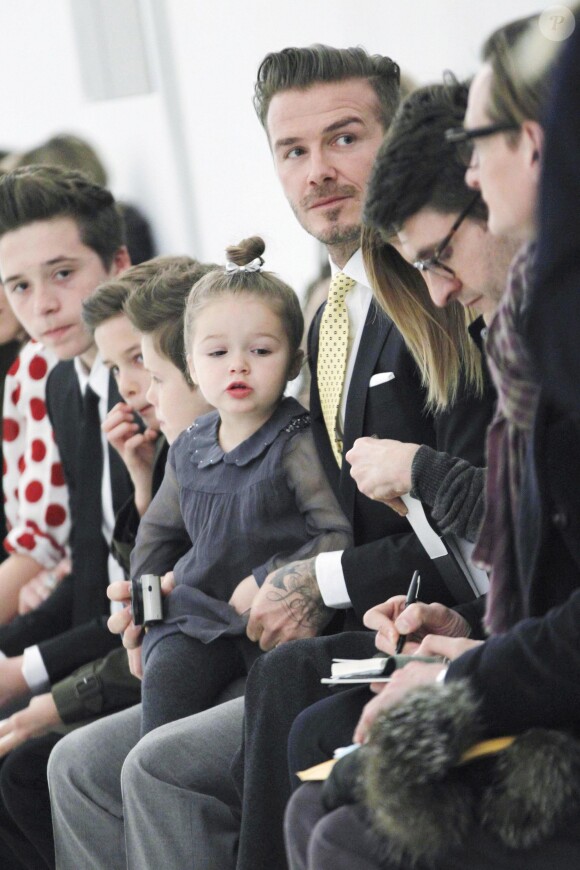 David Beckham et ses enfants Harper, Romeo, Cruz et Brooklyn sont venus soutenir Victoria Beckham lors de la présentation de sa collection automne/hiver 2014 à New York le 9 février 2014