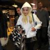 Rita Ora arrive à l'aéroport Linate à Milan, accompagnée par son chéri Calvin Harris. Le 20 février 2014.