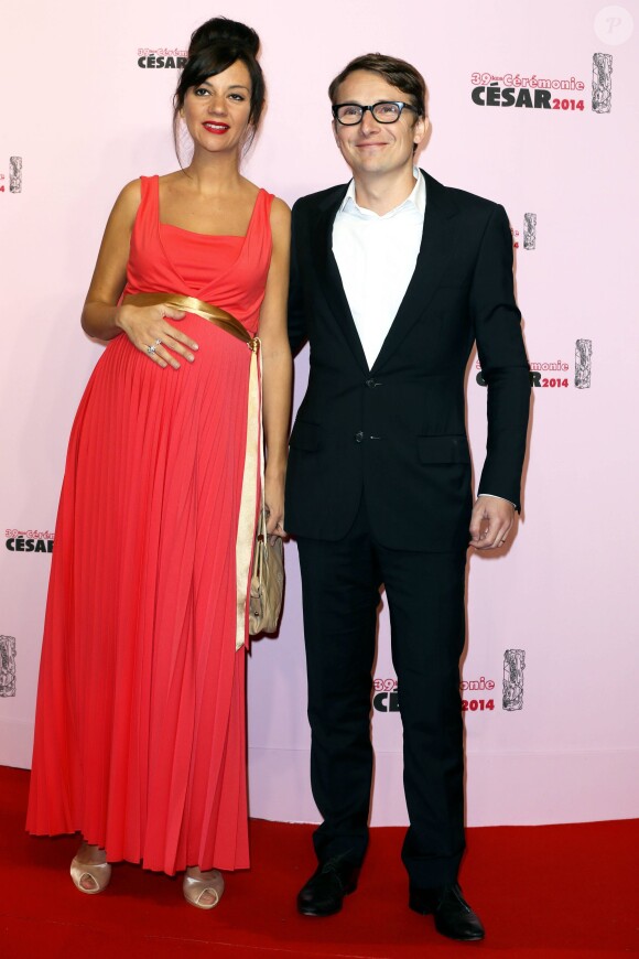 Lorànt Deutsch et sa femme Marie-Julie Baup (enceinte) lors de la 39e cérémonie des César au théâtre du Châtelet à Paris, le 28 Février 2014.