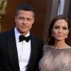 Brad Pitt et Angelina Jolie posent à la 86e cérémonie des Oscars à Hollywood, le 2 mars 2014.