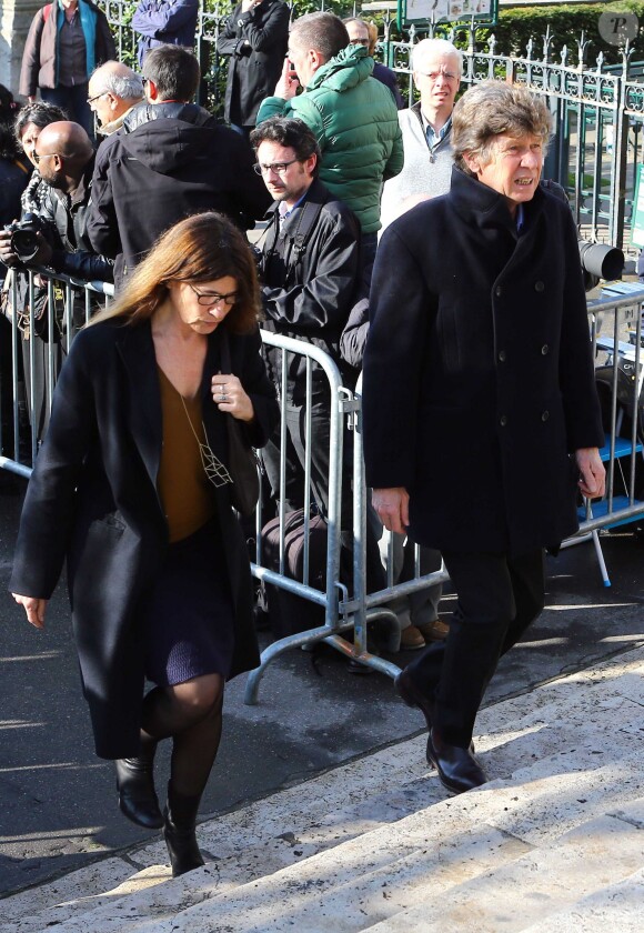 Etienne Chatiliez et sa femme lors des funérailles d'Alain Resnais en l'église Saint-Vincent-de-Paul à Paris le 10 mars 2014