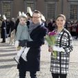 La princesse Victoria, le prince Daniel et leur fille la princesse Estelle de Suède lors de la cérémonie organisée à l'occasion du jour de la Sainte Victoria dans la cour intérieur du palais royal à Stockholm, le 12 mars 2014.