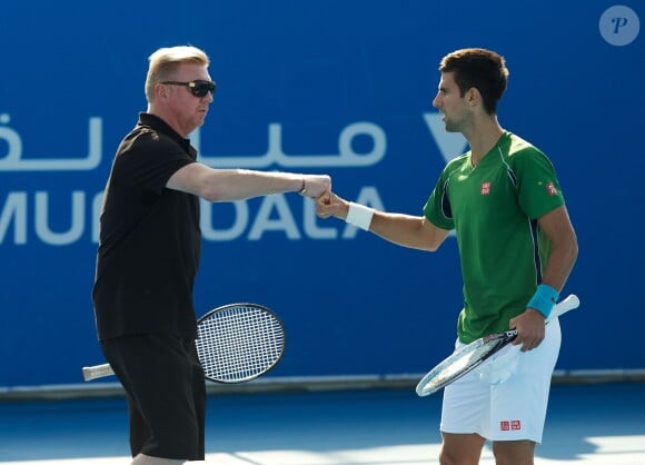 Boris Becker et Novak Djokovic lors d'un entraînement à Abu Dhabi, le 27 décembre 2013