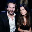 Frédéric Beigbeder et Lara Micheli au défilé de la collection Natalia pour Etam à la Bourse du Commerce à Paris, le 25 février 2014.