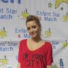 Priscilla participe à un tournoi de tennis pour l'association Enfant Star et Match, à Paris, en mars 2012.