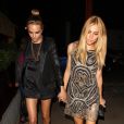  Cara Delevingne et Sienna Miller ont poursuivi leur soir&eacute;e Kate Moss pour Topshop au Loulou's. Londres, le 29 avril 2014. 