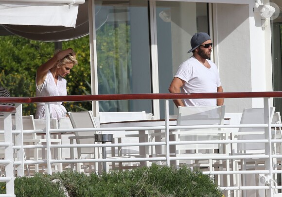 Pamela Anderson et son mari Rick Salomon sont descendus à l'hôtel Eden Roc au Cap d'Antibes, le 13 mai 2014. Le couple est venu pour participer au 67e Festival du Film de Cannes.