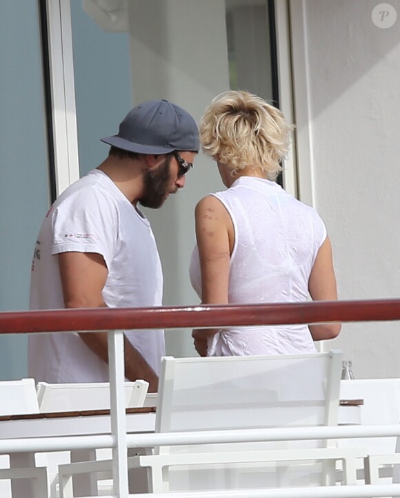Pamela Anderson et son mari Rick Salomon sont descendus à l'hôtel Eden Roc au Cap d'Antibes, le 13 mai 2014. Le couple est venu pour participer au 67e Festival du Film de Cannes.