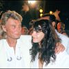 Johnny Hallyday et Adeline Blondieau à Saint-Tropez, le 27 juillet 1991.