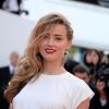 Amber Heard à la montée des marches du film "Deux jours, une nuit" lors du 67e Festival du film de Cannes le 20 mai 2014.