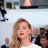 Amber Heard à la montée des marches du film "Deux jours, une nuit" lors du 67e Festival du film de Cannes le 20 mai 2014.