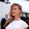 Amber Heard à la montée des marches du film "Deux jours, une nuit" lors du 67 ème Festival du film de Cannes le 20 mai 2014.