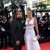 Henri Leconte et son épouse Florentine à la montée des marches du film "Deux jours, une nuit" lors du 67e Festival du film de Cannes le 20 mai 2014.