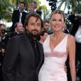 Henri Leconte et son épouse Florentine à la montée des marches du film "Deux jours, une nuit" lors du 67e Festival du film de Cannes le 20 mai 2014.