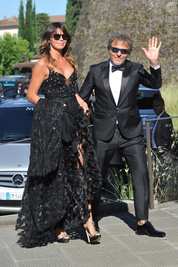 Renzo Rosso et sa compagne Arianna Alessi arrivent au Fort Belvedere pour assister au mariage de Kim Kardashian et Kanye West. Florence, le 24 mai 2014.