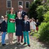 Le prince Laurent et la princesse Claire de Belgique avec leurs fils les jumeaux Nicolas et Aymeric lors de leur première communion le 29 mai 2014 à l'église Sainte-Catherine de Bonlez.