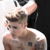Justin Bieber, torse nu, se promène sur la Croisette lors du 67ème festival international du film de Cannes. Le 20 mai 2014.