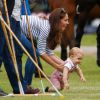 Kate Middleton, duchesse de Cambridge, et le prince George, bientôt 11 mois, étaient présents le 15 juin 2014 au polo club de Cirencester Park, près de Londres, pour voir les princes William et Harry disputer le Jerudong Trophy, rencontre caritative qu'ils ne manquent jamais.