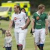 William et Harry, en présence de Kate Middleton et du prince George, disputaient le 15 juin 2014 le Jerudong Trophy au polo club de Cirencester Park, près de Londres, sous le regard de Kate Middleton et du prince George