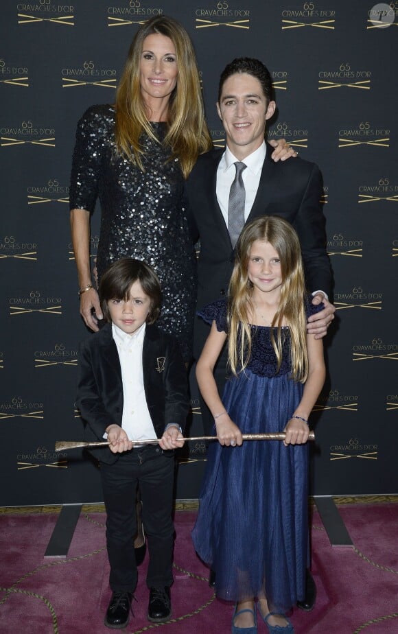 Sophie Thalmann, son mari Christopher Soumillon et leurs enfants Charlie et Mika lors de la 65e édition des Cravaches d'Or au Théâtre des Champs-Elysées à Paris le 14 mars 2014